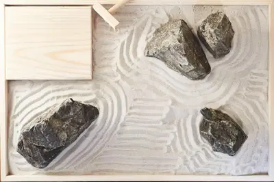 two rocks sitting on top of a wooden table at Annex Shibuya in Tokyo