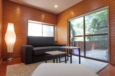 a living room with a couch and a table at Annex Shibuya in Tokyo