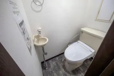 a small bathroom with a toilet and a sink at 3-40-8 / Vacation STAY 77973 in Tokyo