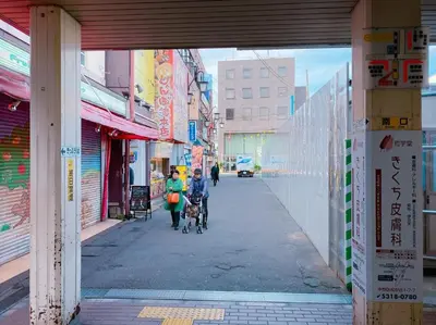 a couple of people walking down a street at 3-40-8 / Vacation STAY 77973 in Tokyo