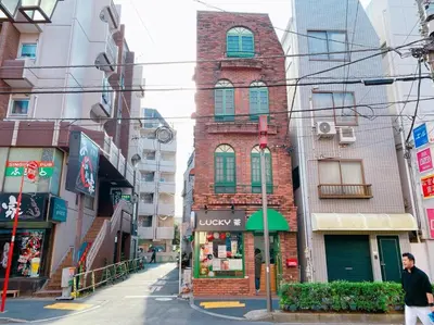 a man walking down a street in a city at 3-40-8 / Vacation STAY 77973 in Tokyo
