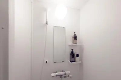 a bathroom with a mirror and a sink at 3-40-8 / Vacation STAY 77968 in Tokyo