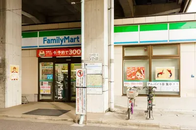 two bikes parked in front of a building at QIQA Residence in Tokyo