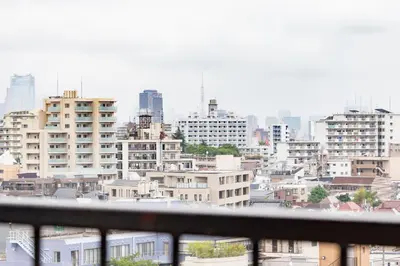 a view of a city from a balcony at HARMONIA\u6771\u4eac\u6e0b\u8c37 shibuya in Tokyo