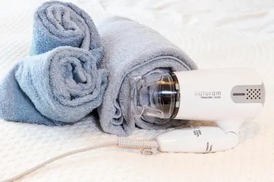 a hair dryer and a hair dryer with a towel at HARMONIA\u6771\u4eac\u6e0b\u8c37 shibuya in Tokyo