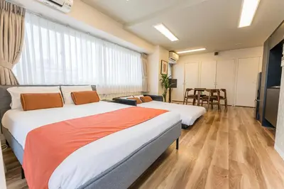 a hotel room with two beds and a kitchen at Oshiage Sky View Terrace Penthouse - brand new Hot Tab installed in 2025- in Tokyo