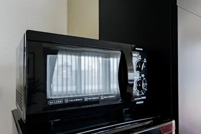 a microwave oven sitting on top of a shelf at Oshiage Sky View Terrace Penthouse - brand new Hot Tab installed in 2025- in Tokyo