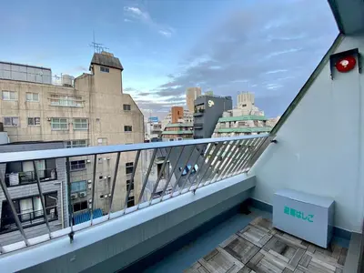 a balcony with a view of a city at CASA VERDE Shinjuku# 1K in Tokyo