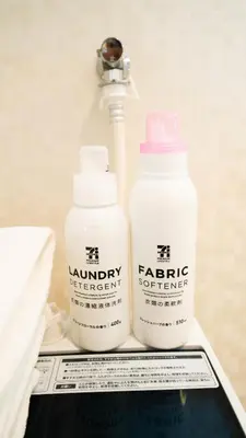 two bottles of laundry detergent are sitting on a table at CASA VERDE Shinjuku# 1K in Tokyo