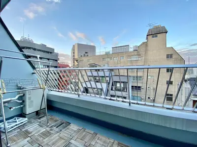 a balcony with a view of a building at CASA VERDE Shinjuku# 1K in Tokyo