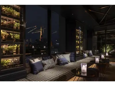 a room with couches and tables with a view of the city at THE LIVELY AZABUJUBAN TOKYO / Vacation STAY 77702 in Tokyo