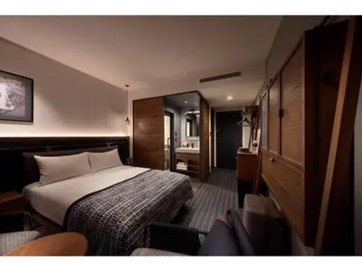 a hotel room with a bed and a chair at THE LIVELY AZABUJUBAN TOKYO / Vacation STAY 77702 in Tokyo