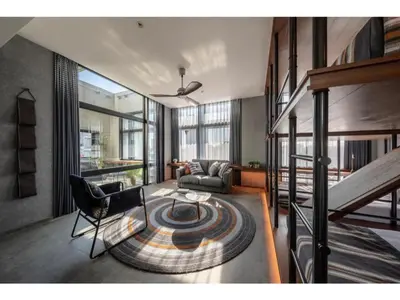 a living room with a couch and a table at THE LIVELY AZABUJUBAN TOKYO / Vacation STAY 77707 in Tokyo