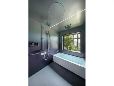 a bathroom with a bath tub and a window at THE LIVELY AZABUJUBAN TOKYO / Vacation STAY 77707 in Tokyo