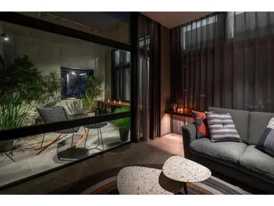 a living room with a couch and a table at THE LIVELY AZABUJUBAN TOKYO / Vacation STAY 77707 in Tokyo