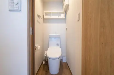 a bathroom with a toilet in a small room at Eisei Stay in Tokyo