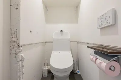 a bathroom with a white toilet in a room at Feel Asakusa Stay in Tokyo