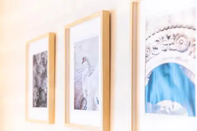 a row of three framed pictures on a wall at \u4e00\u68df\u8cb8\u5207\u5bbf, HARMONIA\u6771\u4eac\u5c0f\u5ca9 6\u540dmax,wifi\u6709,\u79cb\u8449\u539f16\u5206\u65b0\u5bbf33\u5206,\u30c7\u30a3\u30ba\u30cb\u30fc\u96fb\u8eca48\u5206, \u99d0\u8eca\u5834\u3042\u308a\u307e\u305b\u3093 in Tokyo