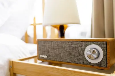 a small radio sitting on a table next to a bed at Maison d'Orme 503 in Tokyo