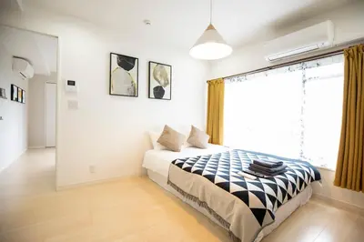 a bedroom with a bed and a large window at \u5bc5\u30db\u30c6\u30eb \u53f0\u6771 Hotel \u5bc5 \u53f0\u4e1c Tora Hotel Taito C in Tokyo