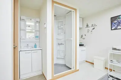 a bathroom with a toilet and a sink and a mirror at \u5bc5\u30db\u30c6\u30eb \u53f0\u6771 Hotel \u5bc5 \u53f0\u4e1c Tora Hotel Taito A in Tokyo