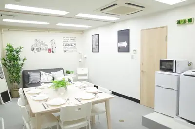 a dining room with a table and a refrigerator at \u5bc5\u30db\u30c6\u30eb \u53f0\u6771 Hotel \u5bc5 \u53f0\u4e1c Tora Hotel Taito A in Tokyo