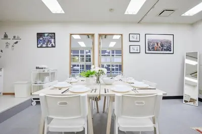 a dining room with a white table and white chairs at \u5bc5\u30db\u30c6\u30eb \u53f0\u6771 Hotel \u5bc5 \u53f0\u4e1c Tora Hotel Taito A in Tokyo