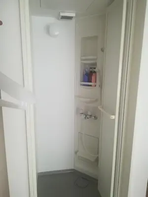 a small bathroom with a white refrigerator in a room at HOTEL LITTLE BIRD OKU-ASAKUSA / Vacation STAY 79448 in Tokyo