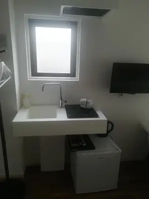 a bathroom with a white sink and a window at HOTEL LITTLE BIRD OKU-ASAKUSA / Vacation STAY 79448 in Tokyo