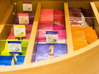 a shelf filled with different colored books on display at Super Hotel Tokyo Kinshicho Ekimae / Vacation STAY 79364 in Tokyo