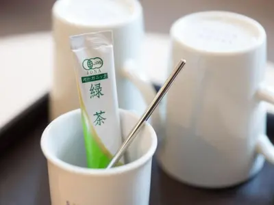 a cup with a toothbrush in it next to two cups at Super Hotel Tokyo Kinshicho Ekimae / Vacation STAY 79364 in Tokyo