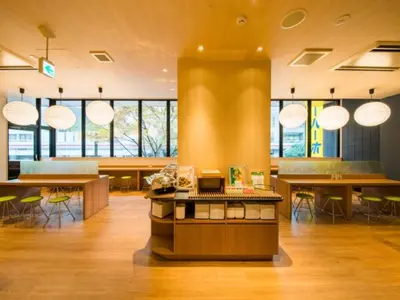 a large room with tables and chairs and windows at Super Hotel Tokyo Kinshicho Ekimae / Vacation STAY 79359 in Tokyo