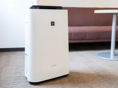 a white refrigerator sitting on the floor in a living room at Super Hotel Tokyo Kinshicho Ekimae / Vacation STAY 79356 in Tokyo