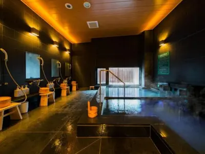 a bathroom with a tub with toilets and a swimming pool at Super Hotel Tokyo Kinshicho Ekimae / Vacation STAY 79356 in Tokyo