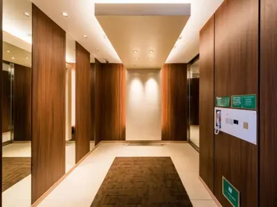 a hallway with wood paneling and a hallway with a rug at Super Hotel Tokyo Kinshicho Ekimae / Vacation STAY 79354 in Tokyo