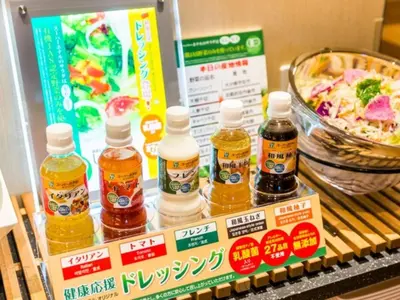 a shelf with bottles of honey and a bowl of food at Super Hotel Tokyo Kinshicho Ekimae / Vacation STAY 79346 in Tokyo