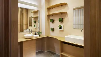 a bathroom with a sink and a mirror at Minn Kamata in Tokyo