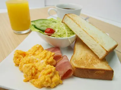 a plate of breakfast food with eggs toast and a salad at Hotel Lotus Koiwa (Adult Only) in Tokyo