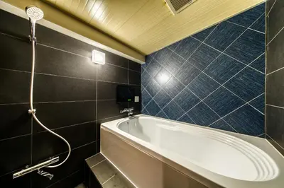 a bathroom with a tub and a shower at Hotel Lotus Koiwa (Adult Only) in Tokyo