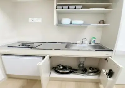 a kitchen with a sink and a counter top at Sunstay - Higashi-Nakano in Tokyo