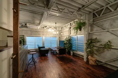 a large room with tables and chairs and plants at prosperityta Yutaka 2F / Vacation STAY 80031 in Tokyo