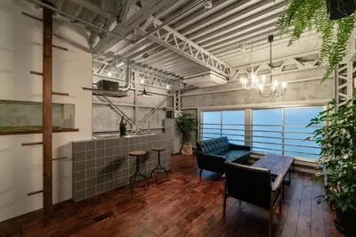 a living room with a couch and a table at prosperityta Yutaka 2F / Vacation STAY 80031 in Tokyo