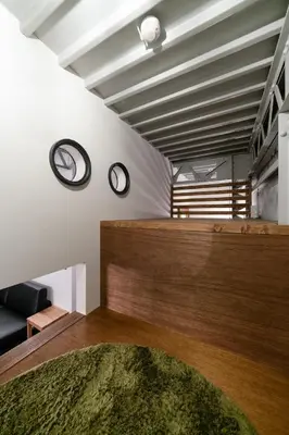 a living room with two clocks on the wall at prosperityta Yutaka 2F / Vacation STAY 80031 in Tokyo
