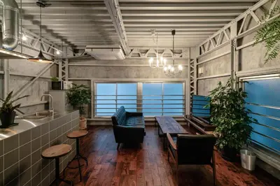 a room with a table and chairs and a view of the ocean at prosperityta Yutaka 2F / Vacation STAY 80031 in Tokyo
