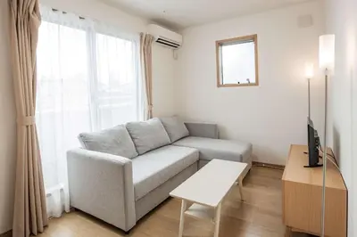 a living room with a couch and a table at Noah Ikebukuro / Vacation STAY 7297 in Tokyo