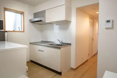 a kitchen with white cabinets and a sink at Noah Ikebukuro / Vacation STAY 7297 in Tokyo