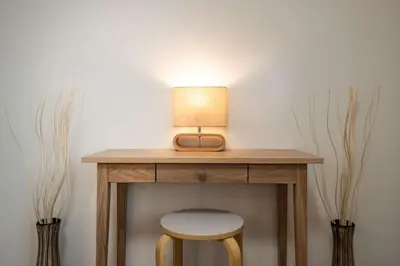 a table with a stool and a lamp on it at Noah Ikebukuro / Vacation STAY 7325 in Tokyo