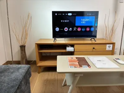 a living room with a tv and a coffee table at Noah Ikebukuro / Vacation STAY 7325 in Tokyo