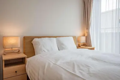 a bedroom with a white bed and a window at Noah Ikebukuro / Vacation STAY 7298 in Tokyo