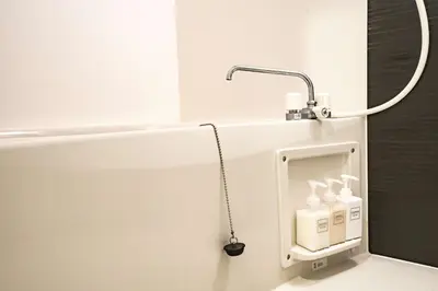 a bathroom with a bath tub with a faucet at Noah Ikebukuro / Vacation STAY 7298 in Tokyo
